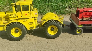 к-700а везёт DT 75 и вагончик за собой RC масштаб 110